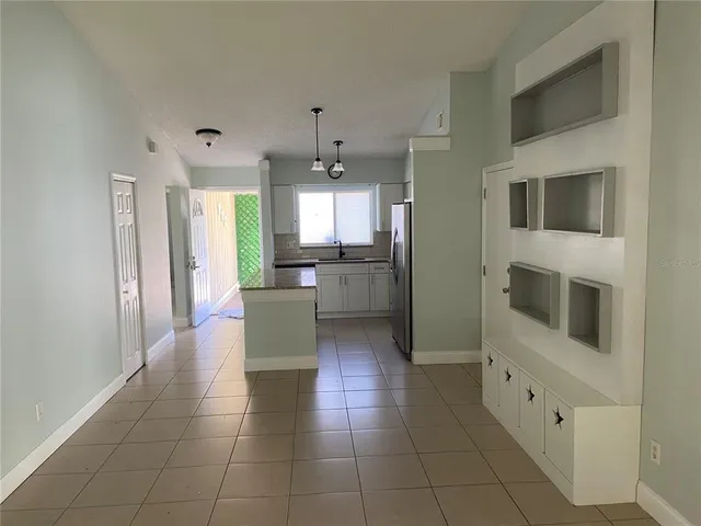 a room with washing machine and window