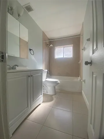 a view of a house with a door and balcony