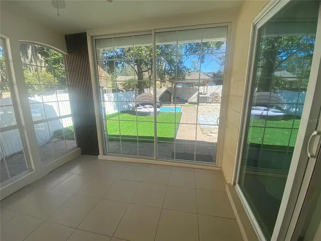 a view of a backyard with sitting area