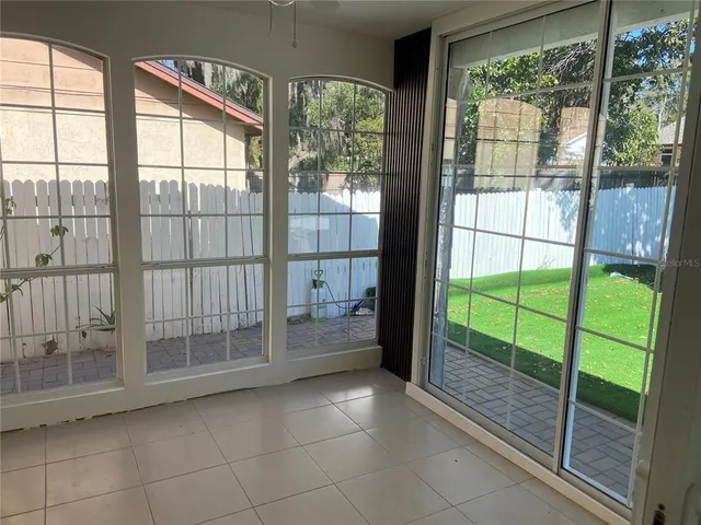a outdoor sitting area with furniture and a rug