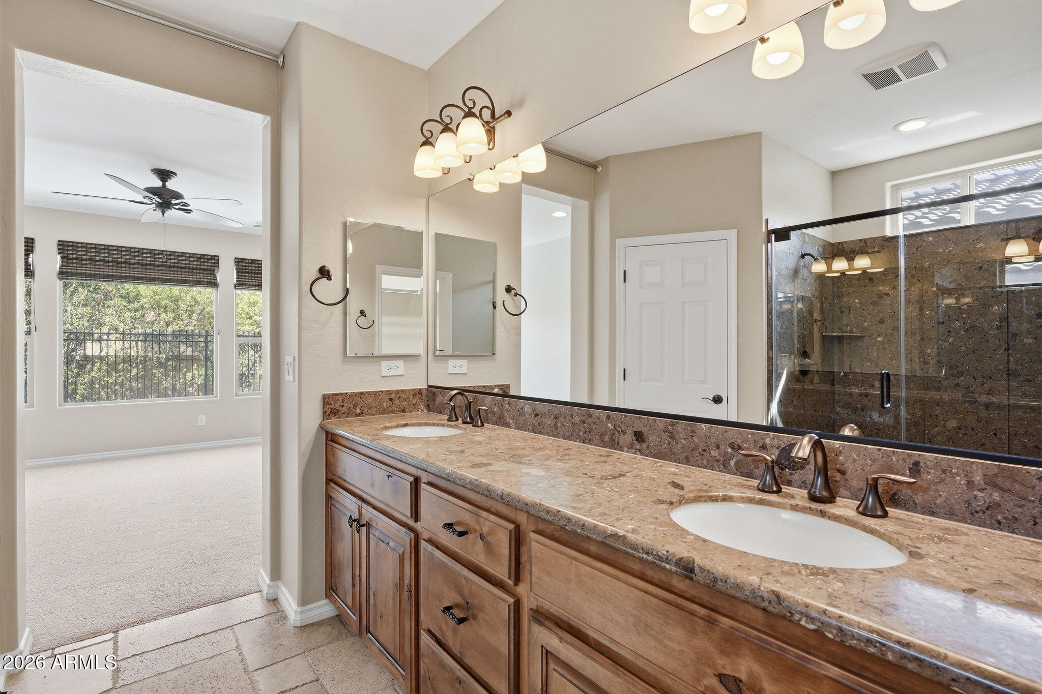 1694 East Grand Ridge Road Queen Creek, AZ 85140 - Photo 28 of 61 a bathroom with a granite countertop sink and a mirror