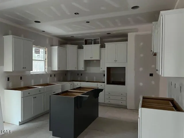 a kitchen that has a sink and a stove in it