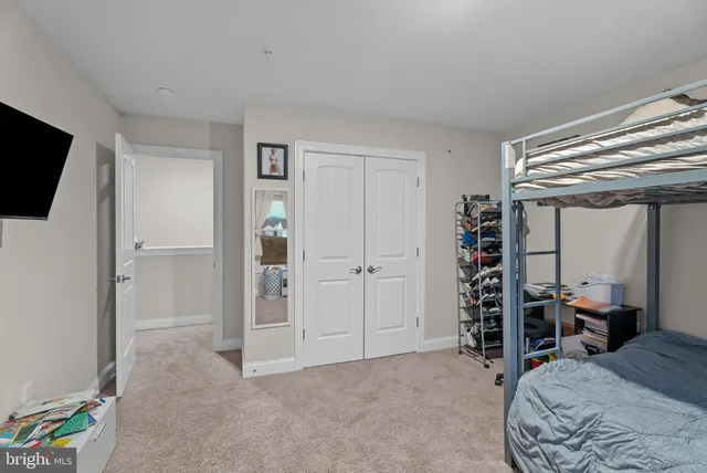 a bed room with a bed and a television