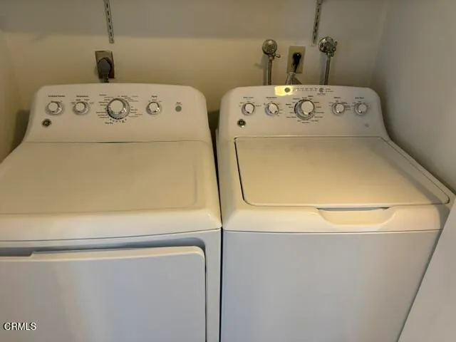 a view of a water heater room with wooden floor