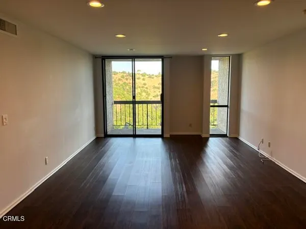 a bath room with granite countertop sink and a mirror