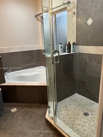 a bathroom with a sink and a shower