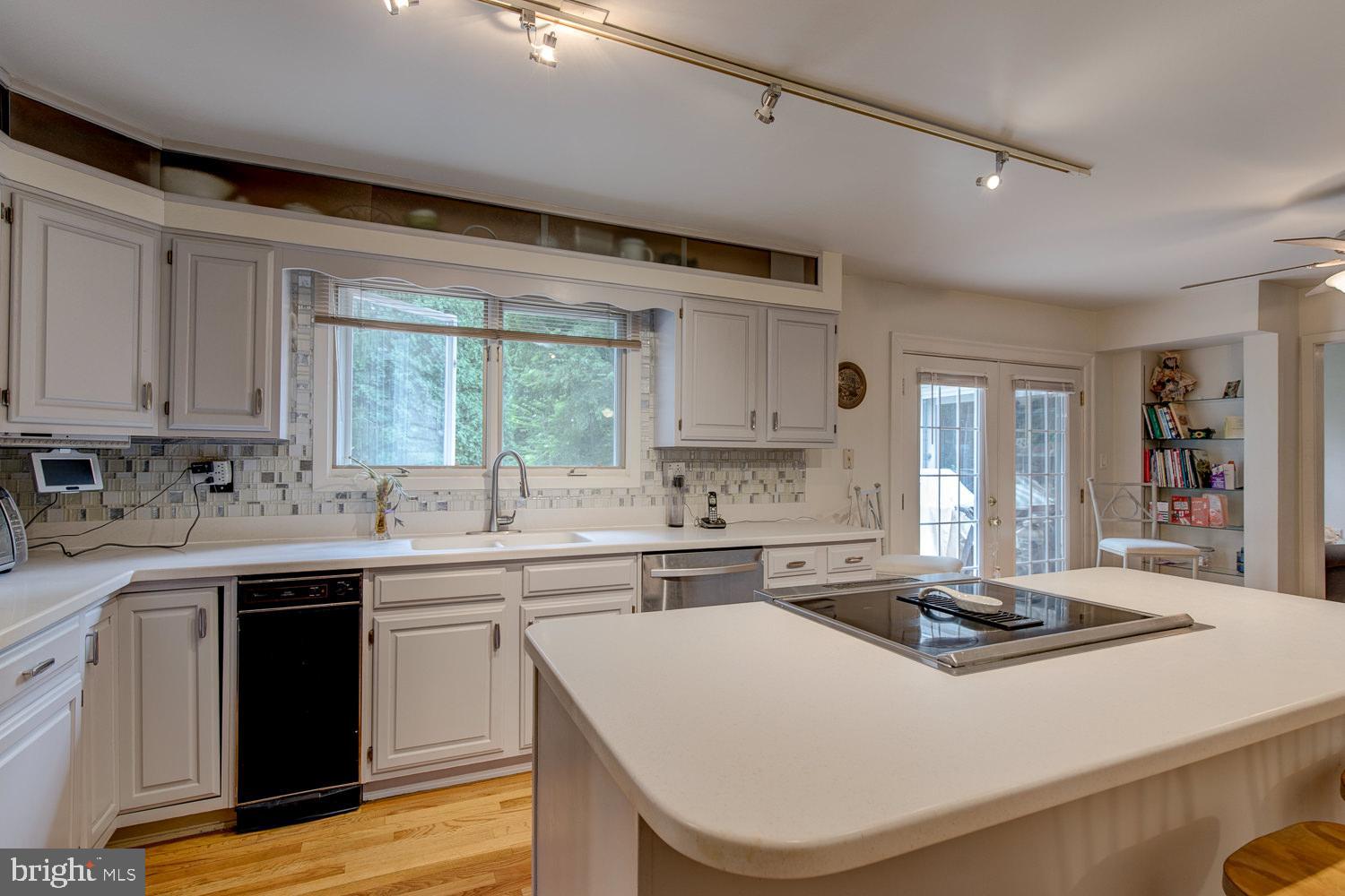 411 Plush Mill Road Wallingford, PA 19086 - Photo 7 of 27 White and grey tones accent the backsplash