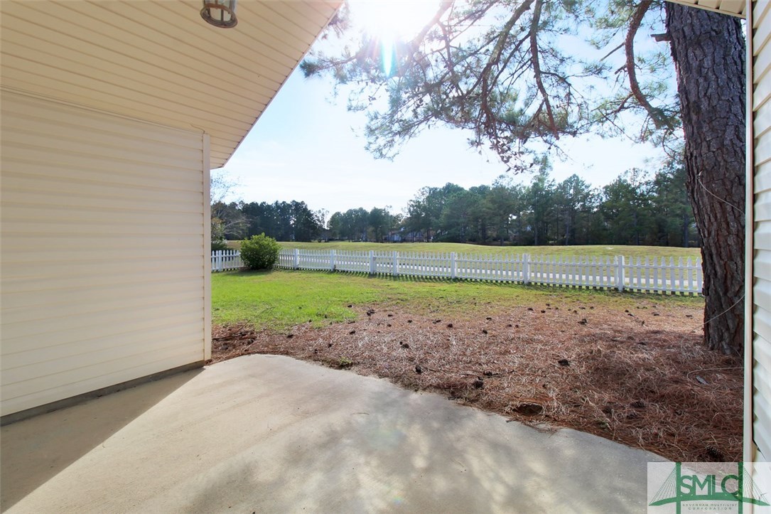 304 Walthour Drive Rincon, GA 31326 - Photo 28 of 40 Covered back porch over looking picket fence back