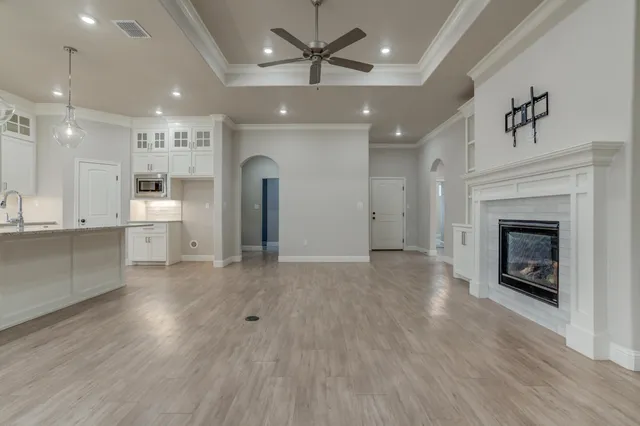 a view of a kitchen with a sink and a refrigerator