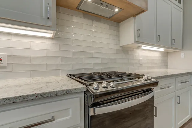 a view of wooden floor and windows in a room