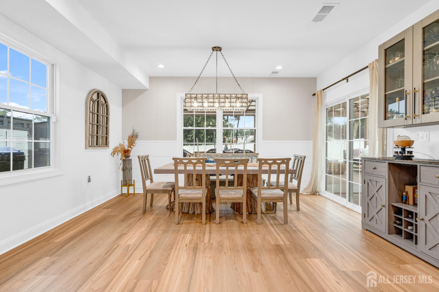 38 Sturgis Road Edison, NJ 08817 - Photo 16 of 41 a dining room with furniture a chandelier and wooden floor