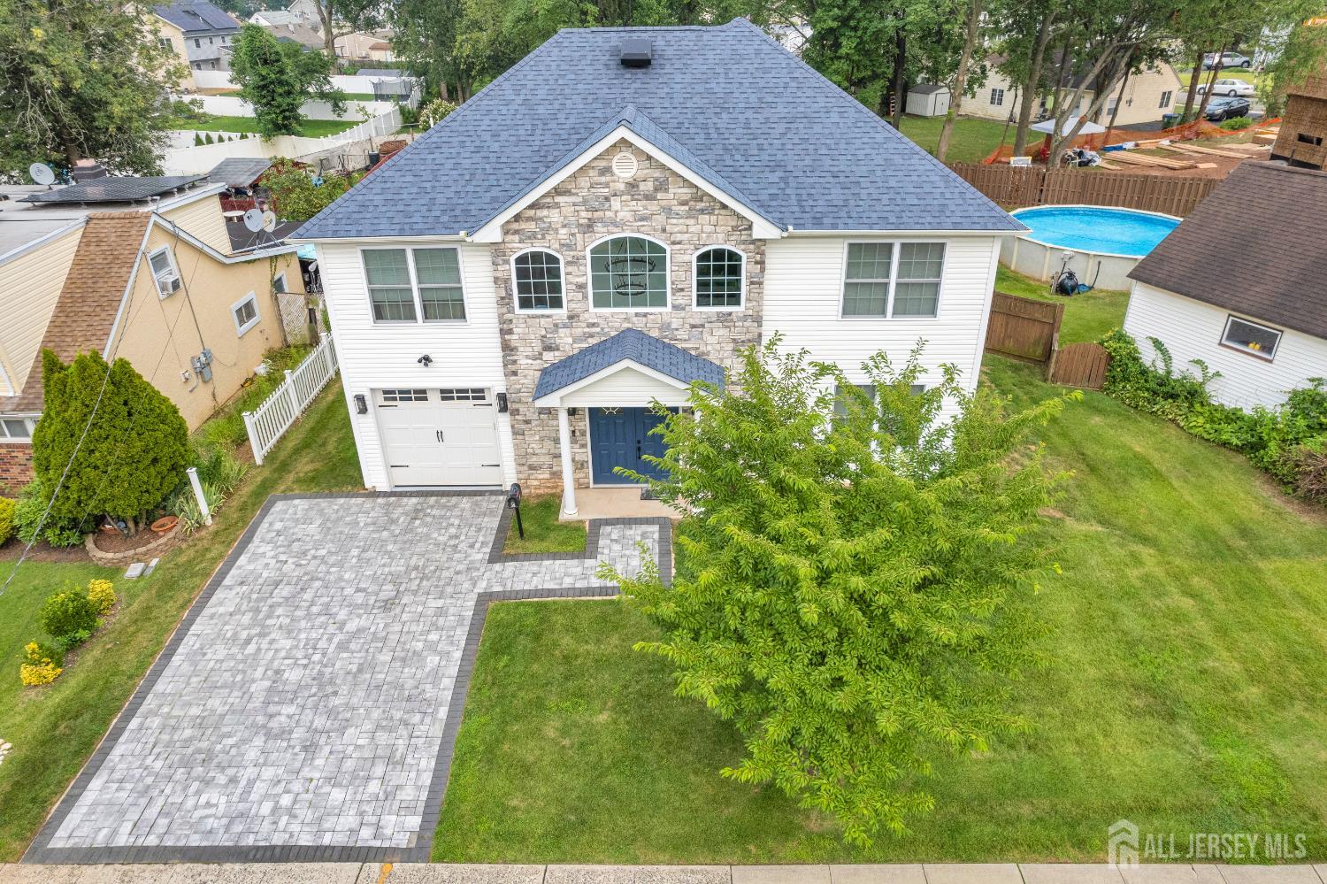 38 Sturgis Road Edison, NJ 08817 - Photo 3 of 41 a front view of a house with a yard