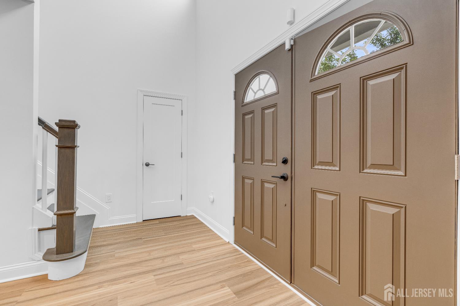 38 Sturgis Road Edison, NJ 08817 - Photo 4 of 41 a view of a entryway door with wooden floor