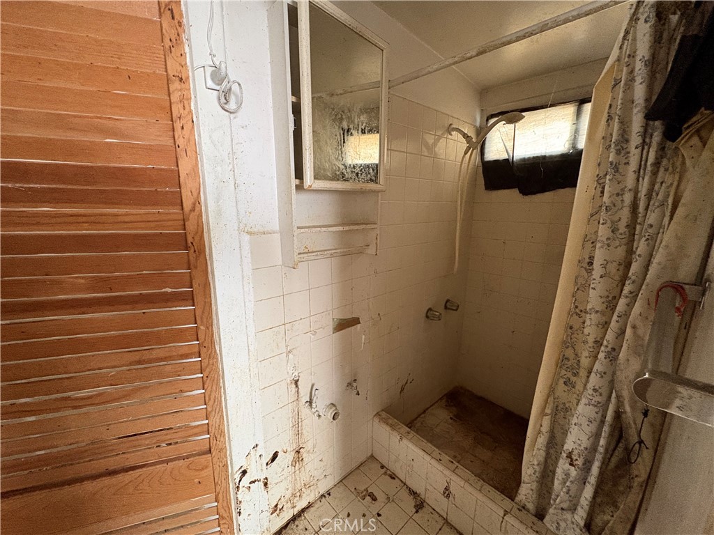 14023 Studebaker Road Norwalk, CA 90650 - Photo 20 of 33 a bathroom with a shower