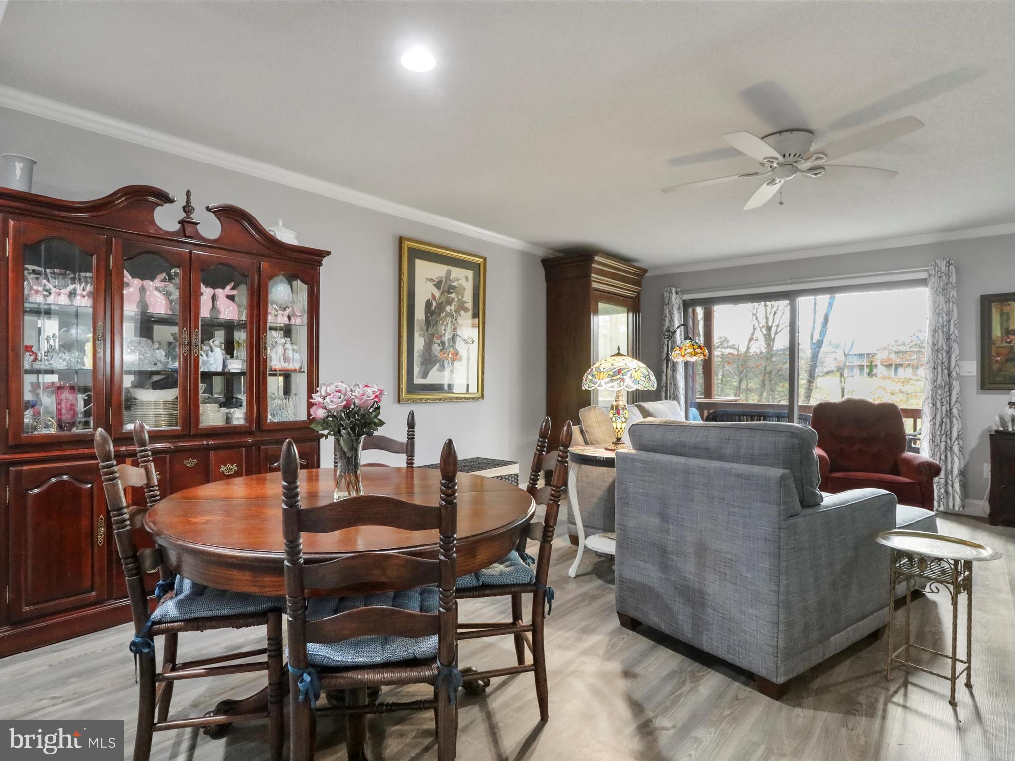 205 Tecumseh Trail Hedgesville, WV 25427 - Photo 13 of 75 a dining room with furniture a flat screen tv and a large window