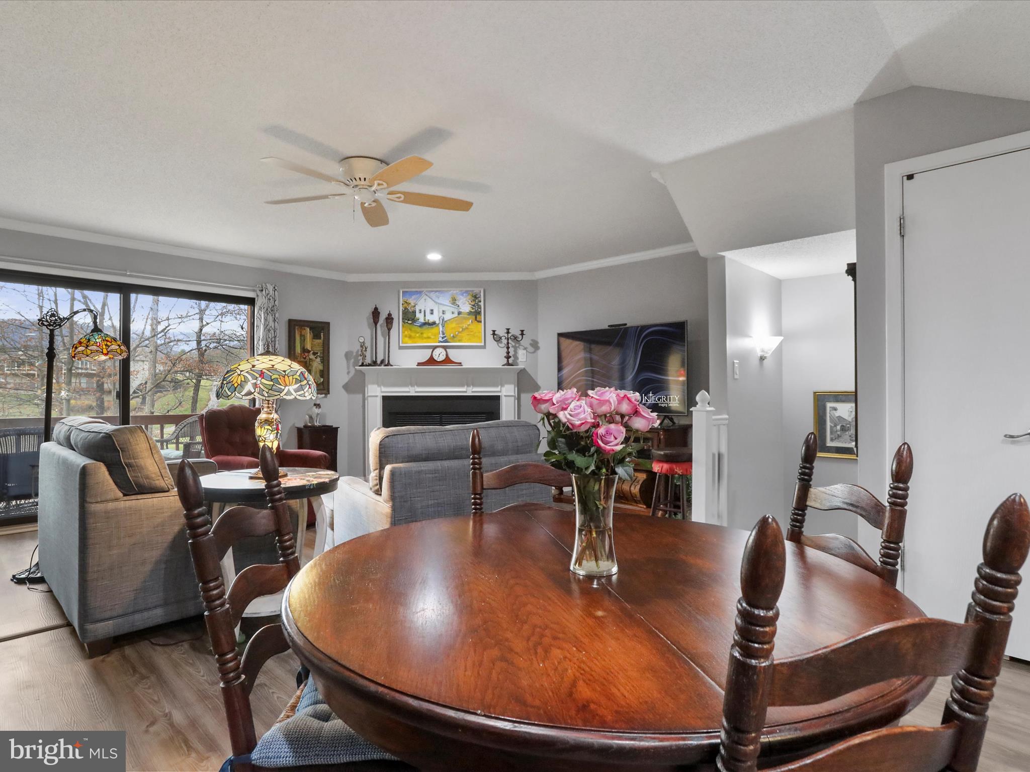 205 Tecumseh Trail Hedgesville, WV 25427 - Photo 14 of 75 a dining room with furniture a floor to ceiling window and wooden floor