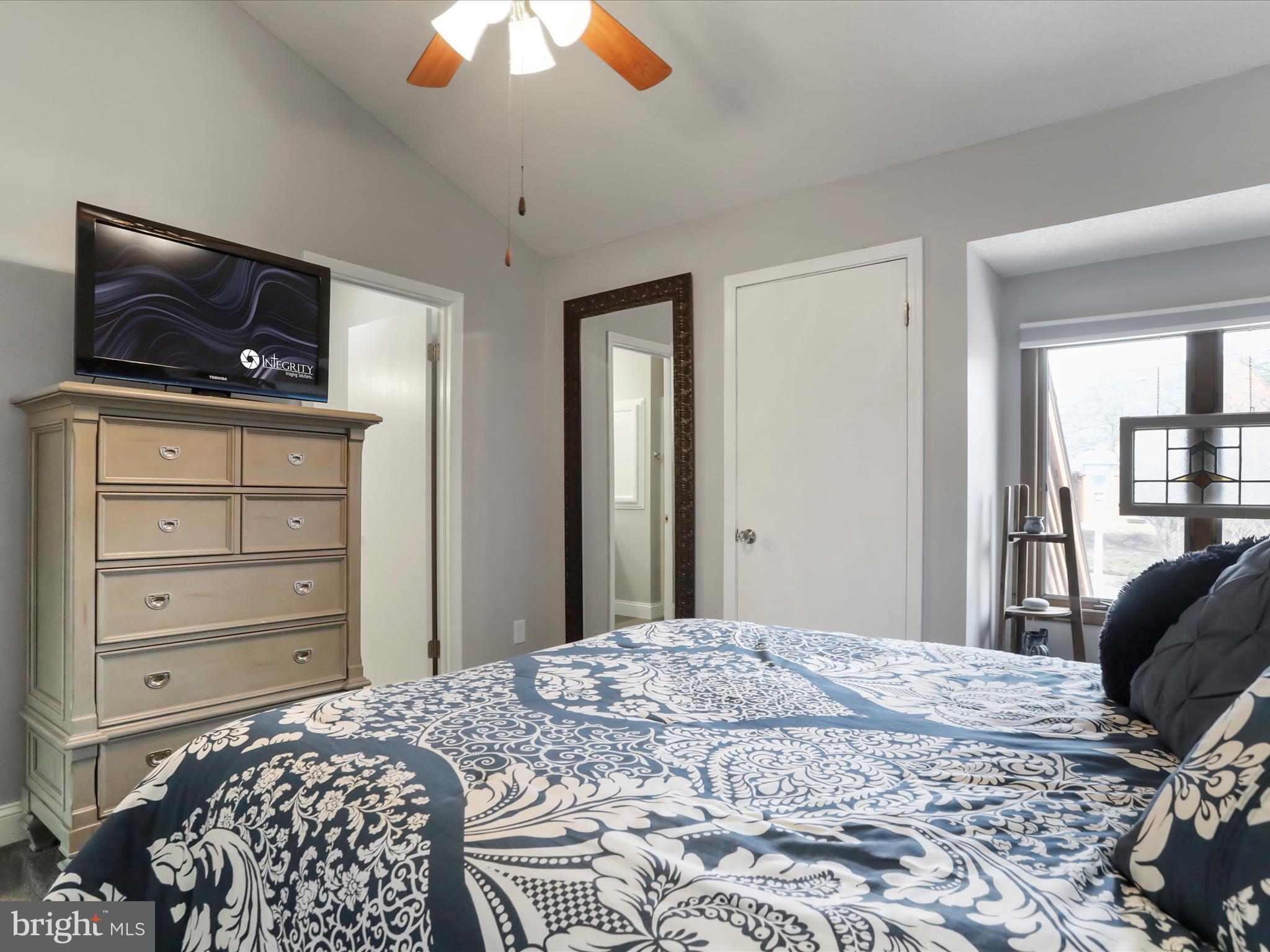 205 Tecumseh Trail Hedgesville, WV 25427 - Photo 18 of 75 a bedroom with a bed and a tv