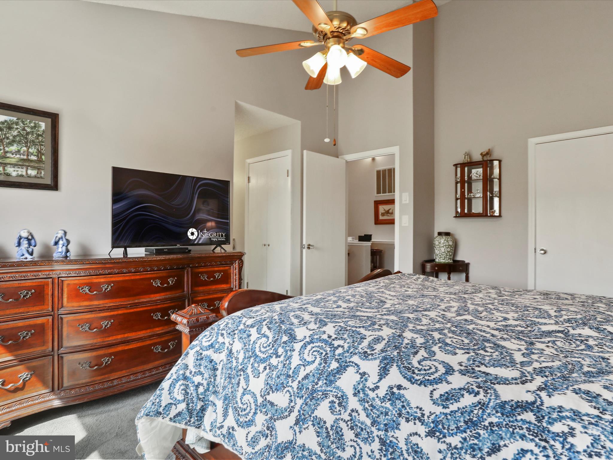 205 Tecumseh Trail Hedgesville, WV 25427 - Photo 24 of 75 a bedroom with a bed and a flat tv screen on dresser