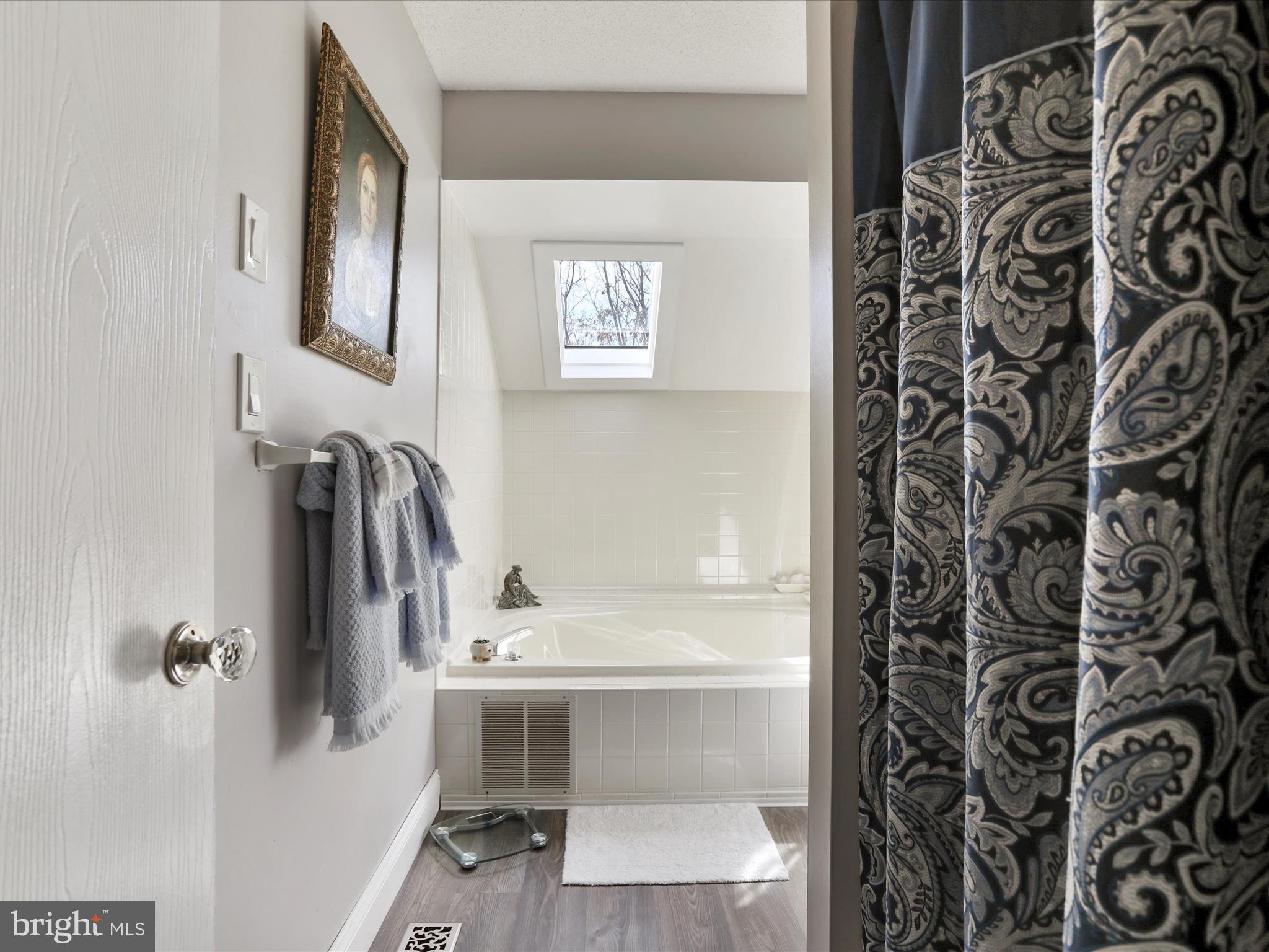 205 Tecumseh Trail Hedgesville, WV 25427 - Photo 27 of 75 a bathroom with a sink and mirror with toilet