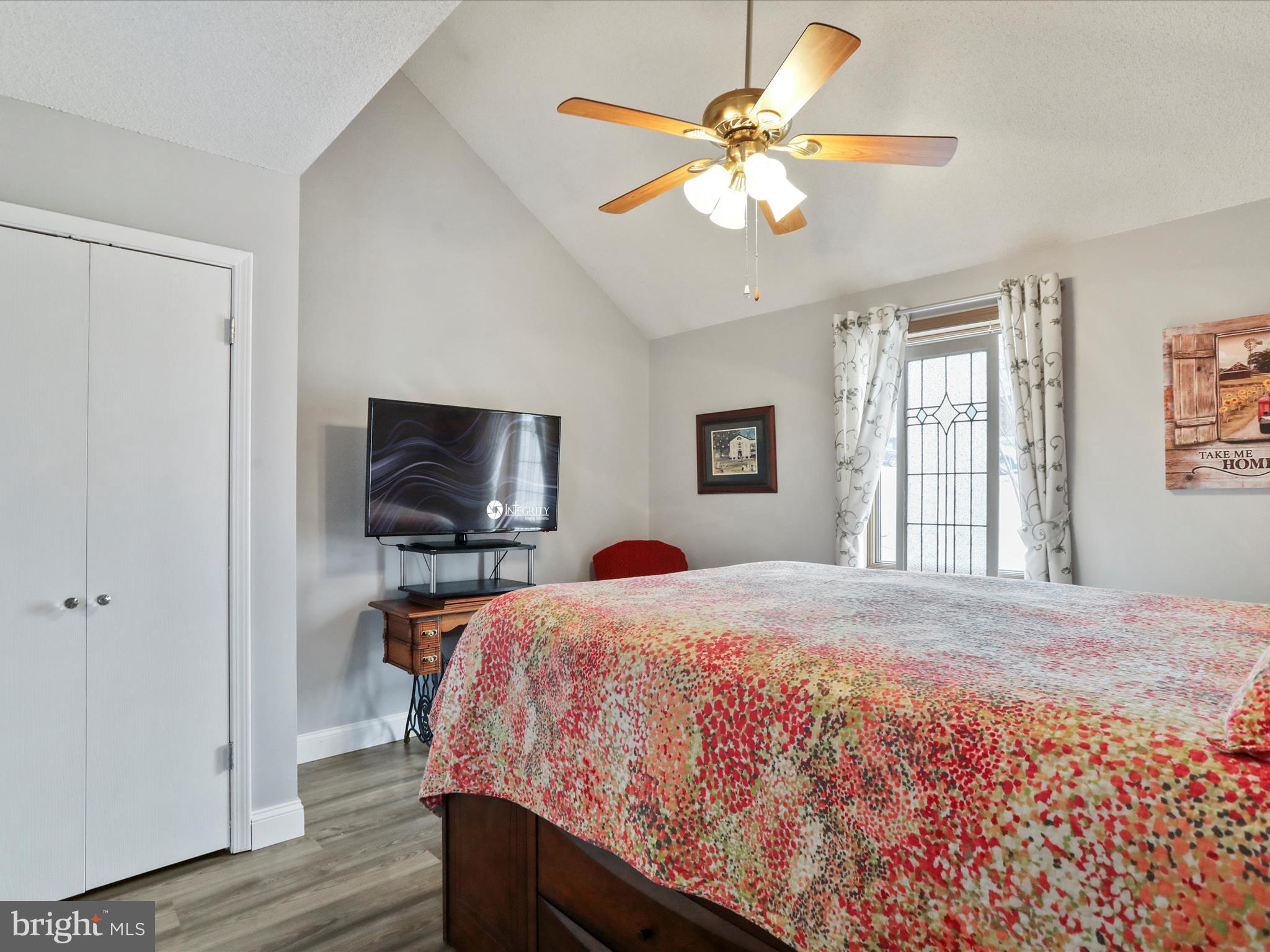 205 Tecumseh Trail Hedgesville, WV 25427 - Photo 3 of 75 a bedroom with a bed and a flat screen tv