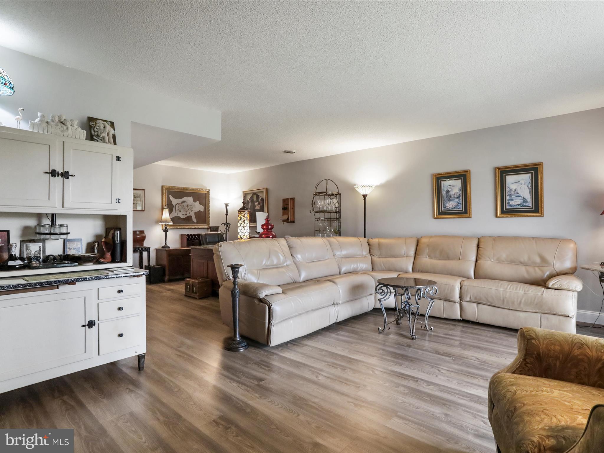 205 Tecumseh Trail Hedgesville, WV 25427 - Photo 32 of 75 a living room with furniture and a wooden floor