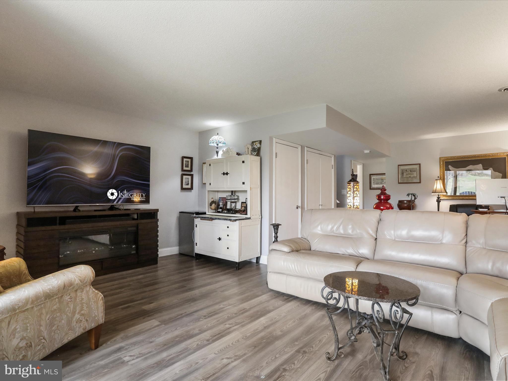 205 Tecumseh Trail Hedgesville, WV 25427 - Photo 33 of 75 a living room with furniture and a flat screen tv