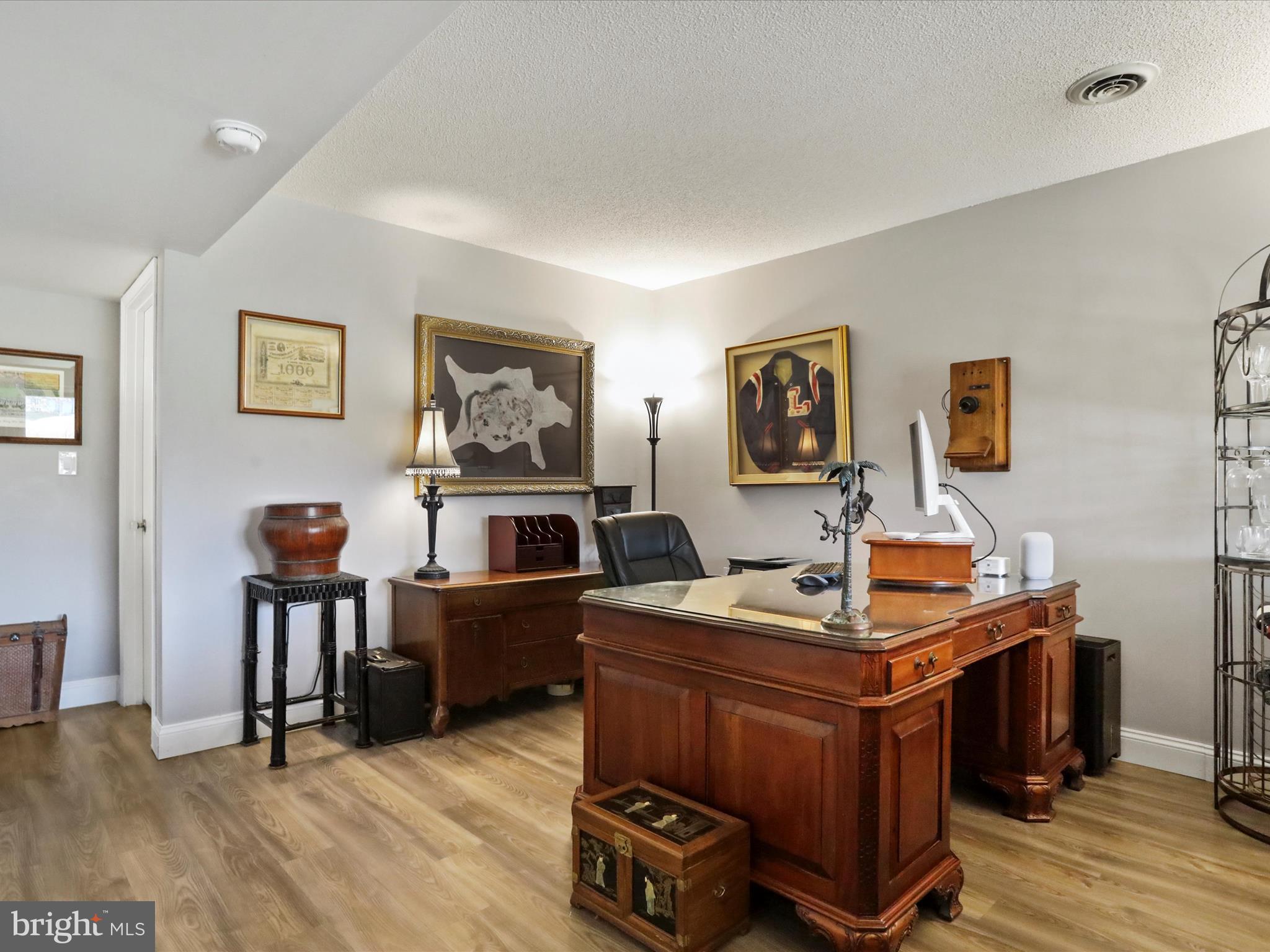 205 Tecumseh Trail Hedgesville, WV 25427 - Photo 34 of 75 a room with furniture and paintings on the wall