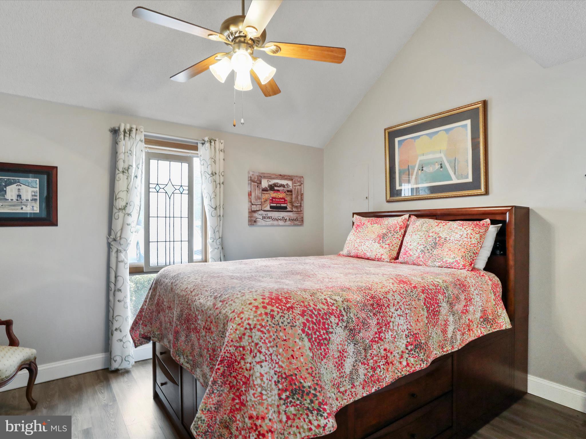 205 Tecumseh Trail Hedgesville, WV 25427 - Photo 4 of 75 a bedroom with a bed and a chandelier