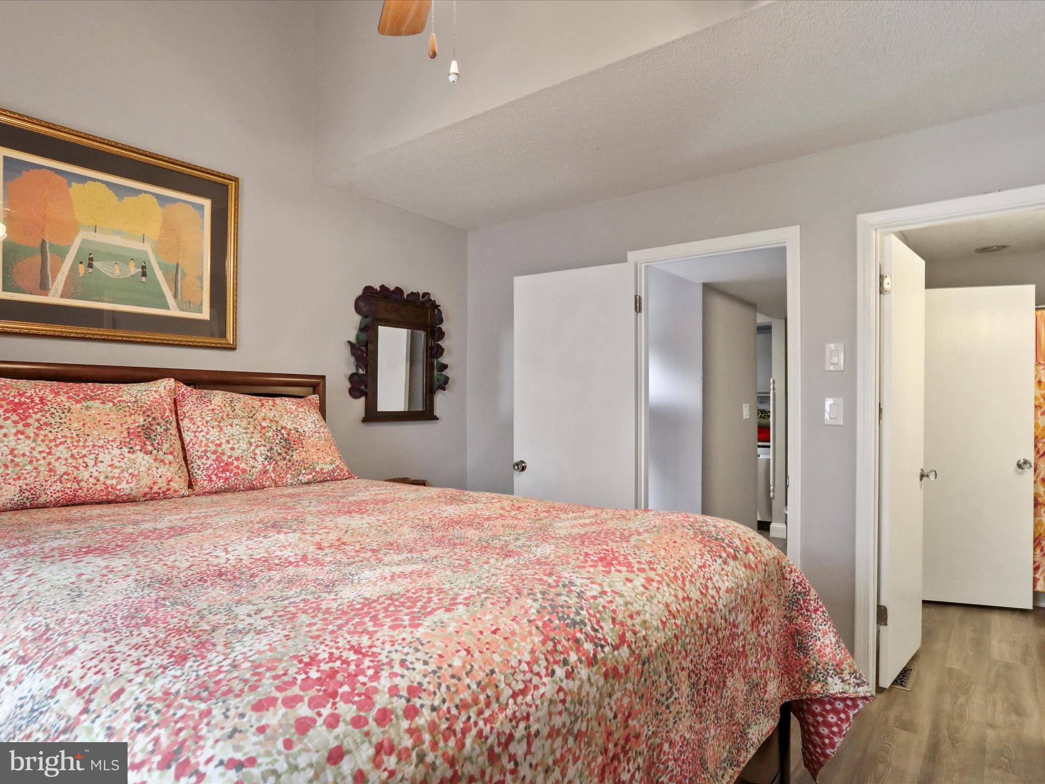 205 Tecumseh Trail Hedgesville, WV 25427 - Photo 5 of 75 a bedroom with a large bed and wooden floor