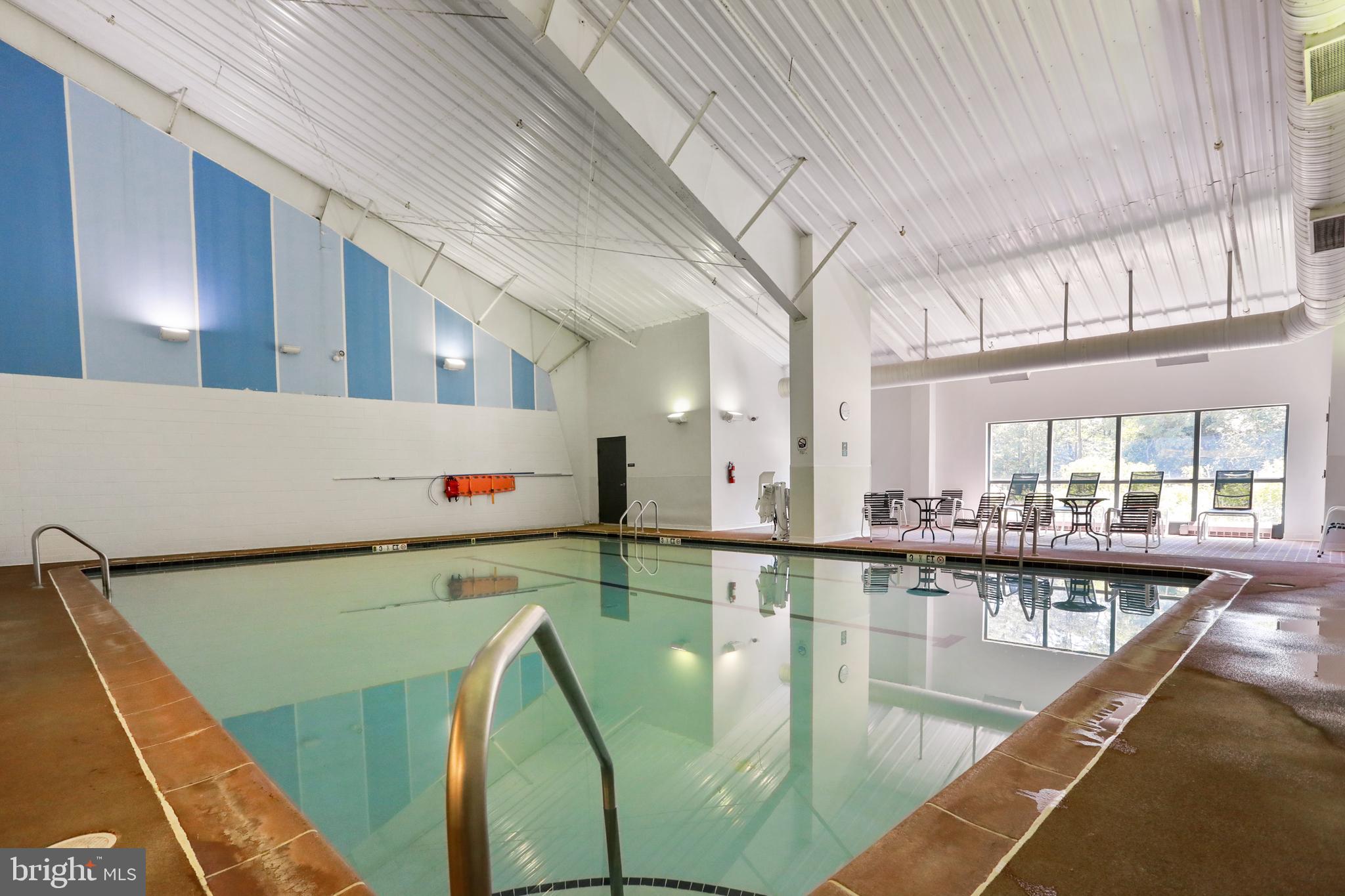 205 Tecumseh Trail Hedgesville, WV 25427 - Photo 60 of 75 a kitchen with stainless steel appliances granite countertop a sink and a refrigerator