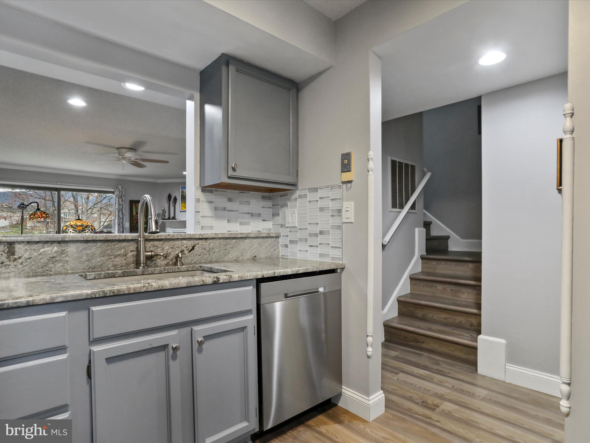 205 Tecumseh Trail Hedgesville, WV 25427 - Photo 9 of 75 a kitchen with stainless steel appliances granite countertop a sink and a refrigerator