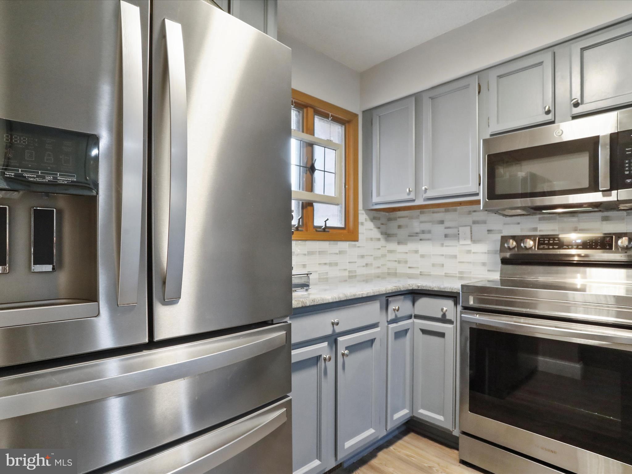 205 Tecumseh Trail Hedgesville, WV 25427 - Photo 10 of 75 a kitchen with cabinets stainless steel appliances and a counter space