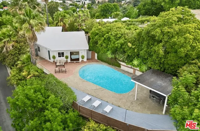 a view of a patio with two chairs and a table