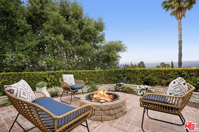 a view of a house with swimming pool and a yard