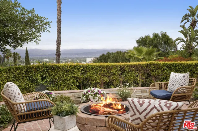 an aerial view of a house with yard and green space