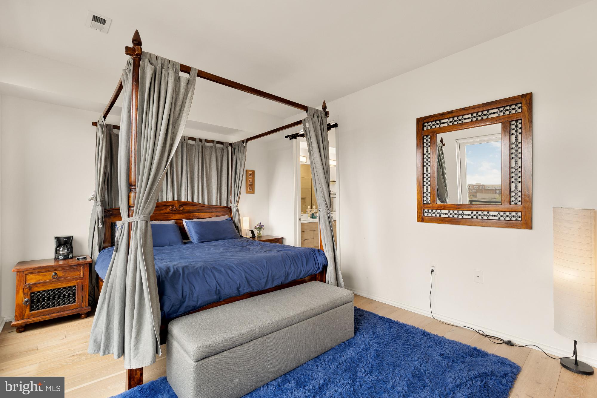 1550 11th Street Northwest, Unit 401 Washington, DC 20005 - Photo 11 of 18 a bedroom with a bed and a window