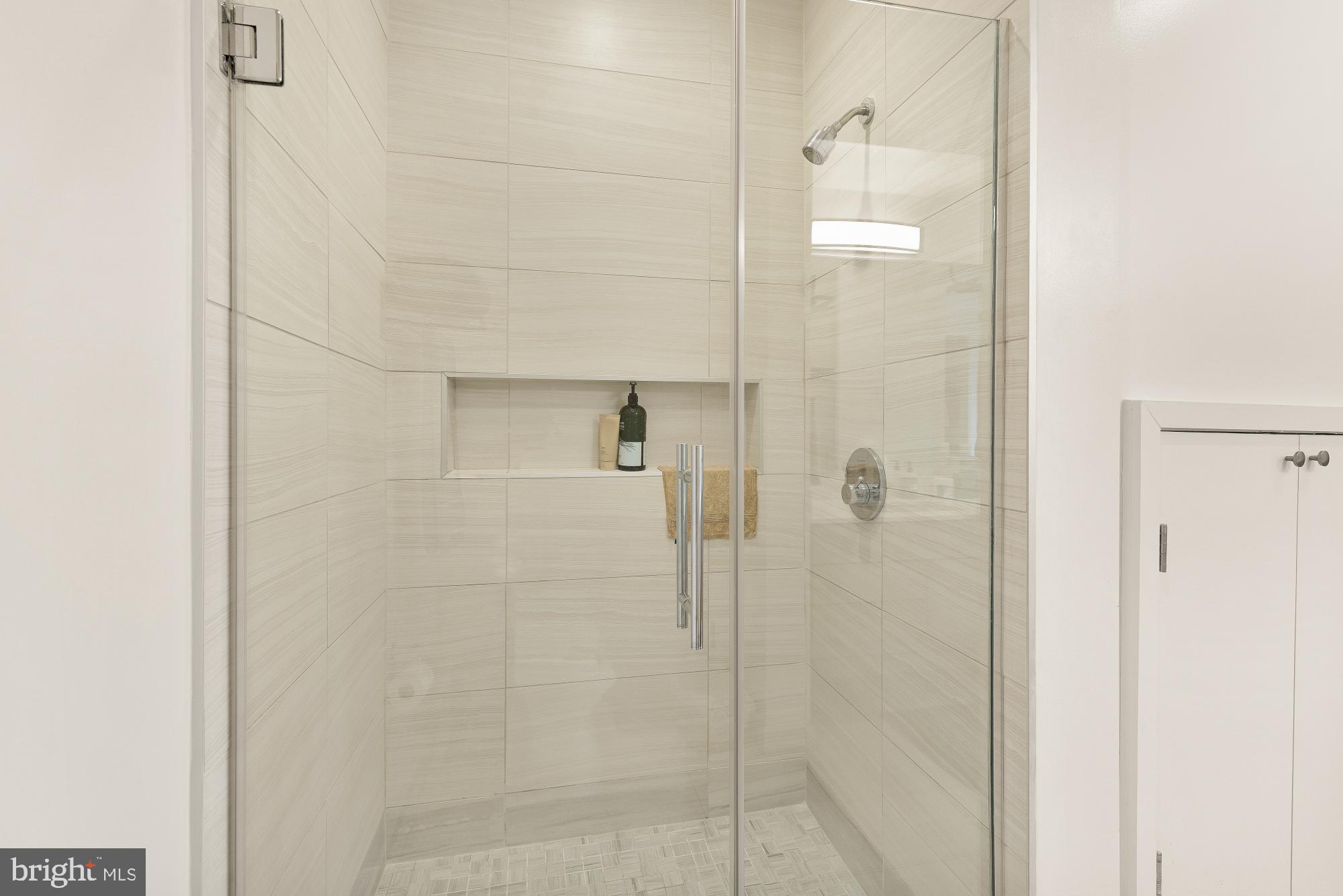 1550 11th Street Northwest, Unit 401 Washington, DC 20005 - Photo 13 of 18 a bathroom with a shower