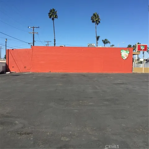 a view of a street with a building in the background