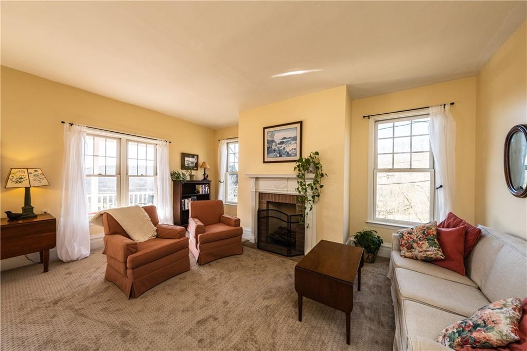 4096 Glasgow Road Valencia, PA 16059 - Photo 3 of 25 Bright formal living room with log burning fire place with accented with beautiful detailed mantle.
