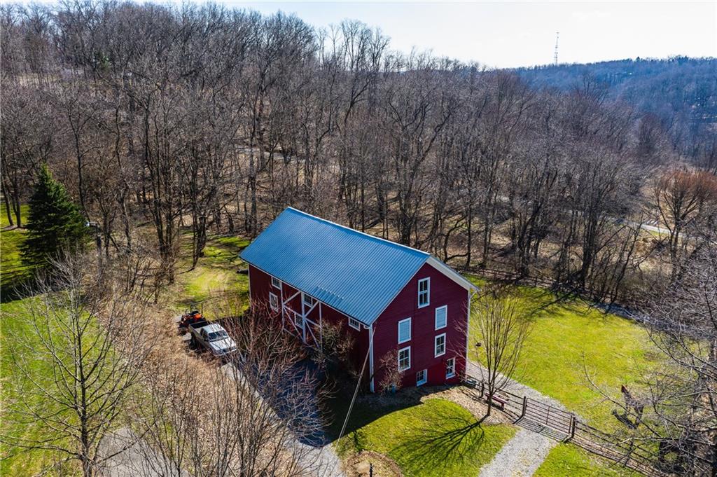 4096 Glasgow Road Valencia, PA 16059 - Photo 23 of 25 Three level barn with new metal roof, fenced level paddock and tractor shed on the lower level.