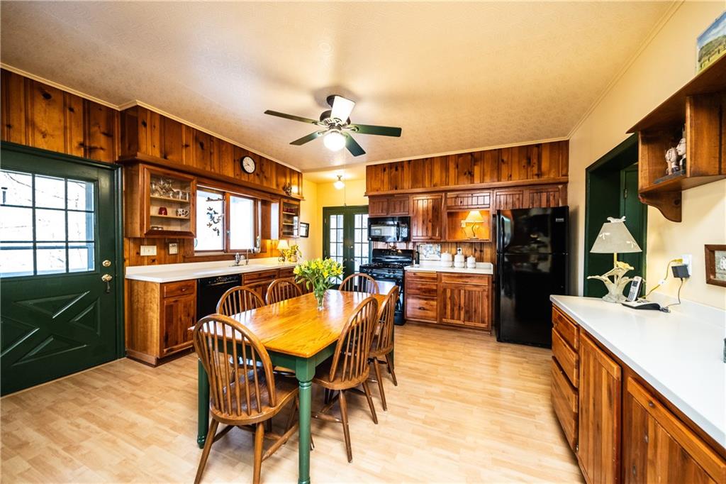 4096 Glasgow Road Valencia, PA 16059 - Photo 5 of 25 Spacious kitchen with lots of counters and cabinets. Powder room and main floor laundry just around the corner in the corridor to the garage and family room. Tucked away nicely from the main rooms of the home!