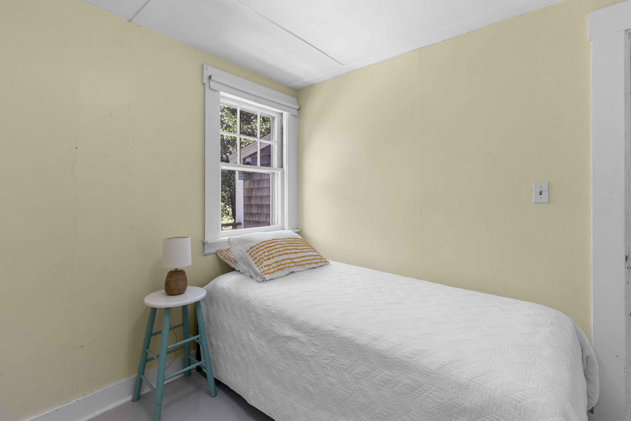 11 Whitmanville Road Truro, MA 02666 - Photo 17 of 31 a bedroom with a bed and a window