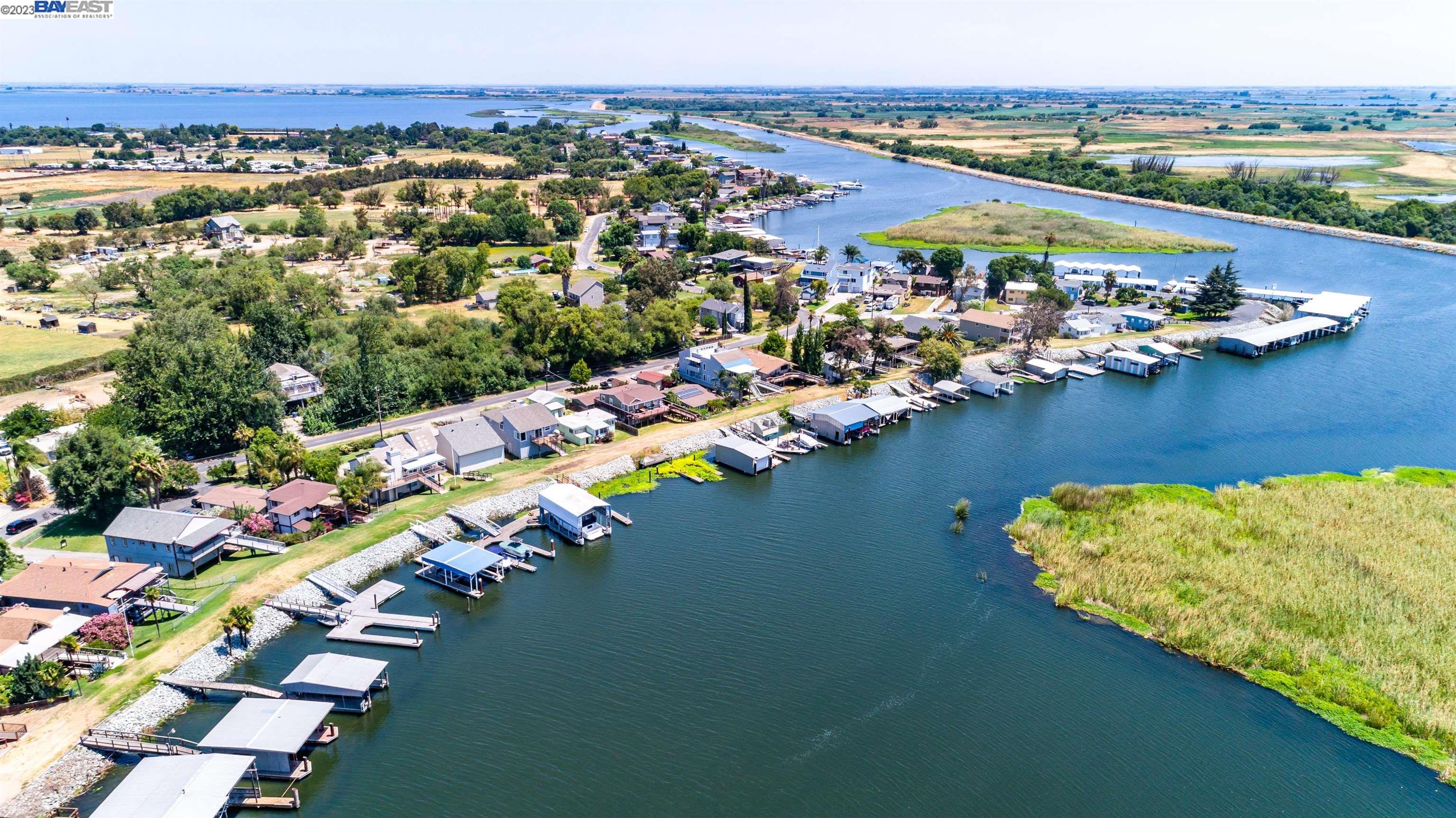 an aerial view of a city with lake view
