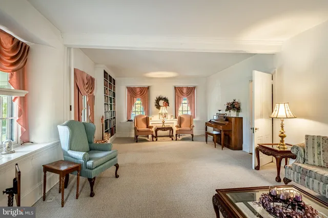 a dining hall with stainless steel appliances kitchen island granite countertop furniture and a kitchen view
