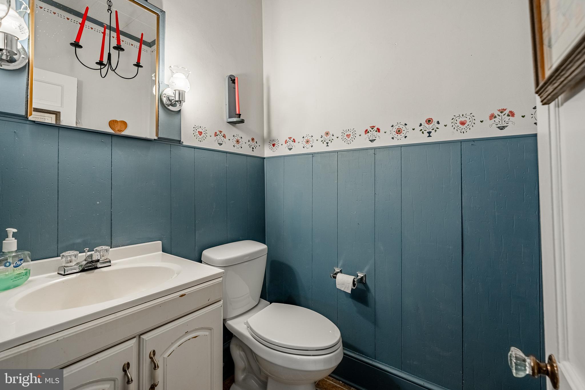51 Scott Road Glen Mills, PA 19342 - Photo 31 of 85 a bathroom with a sink a toilet and mirror