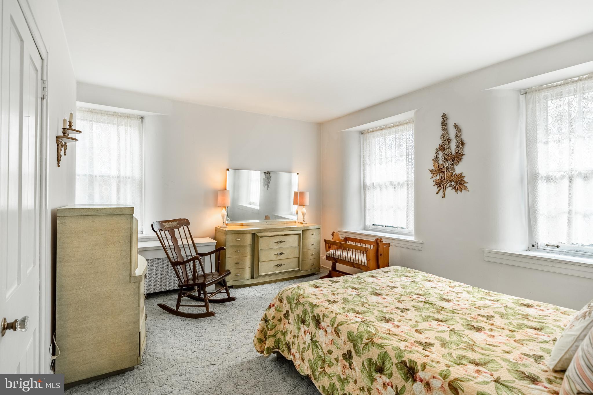 51 Scott Road Glen Mills, PA 19342 - Photo 45 of 85 a bedroom with a bed a table and chair with window