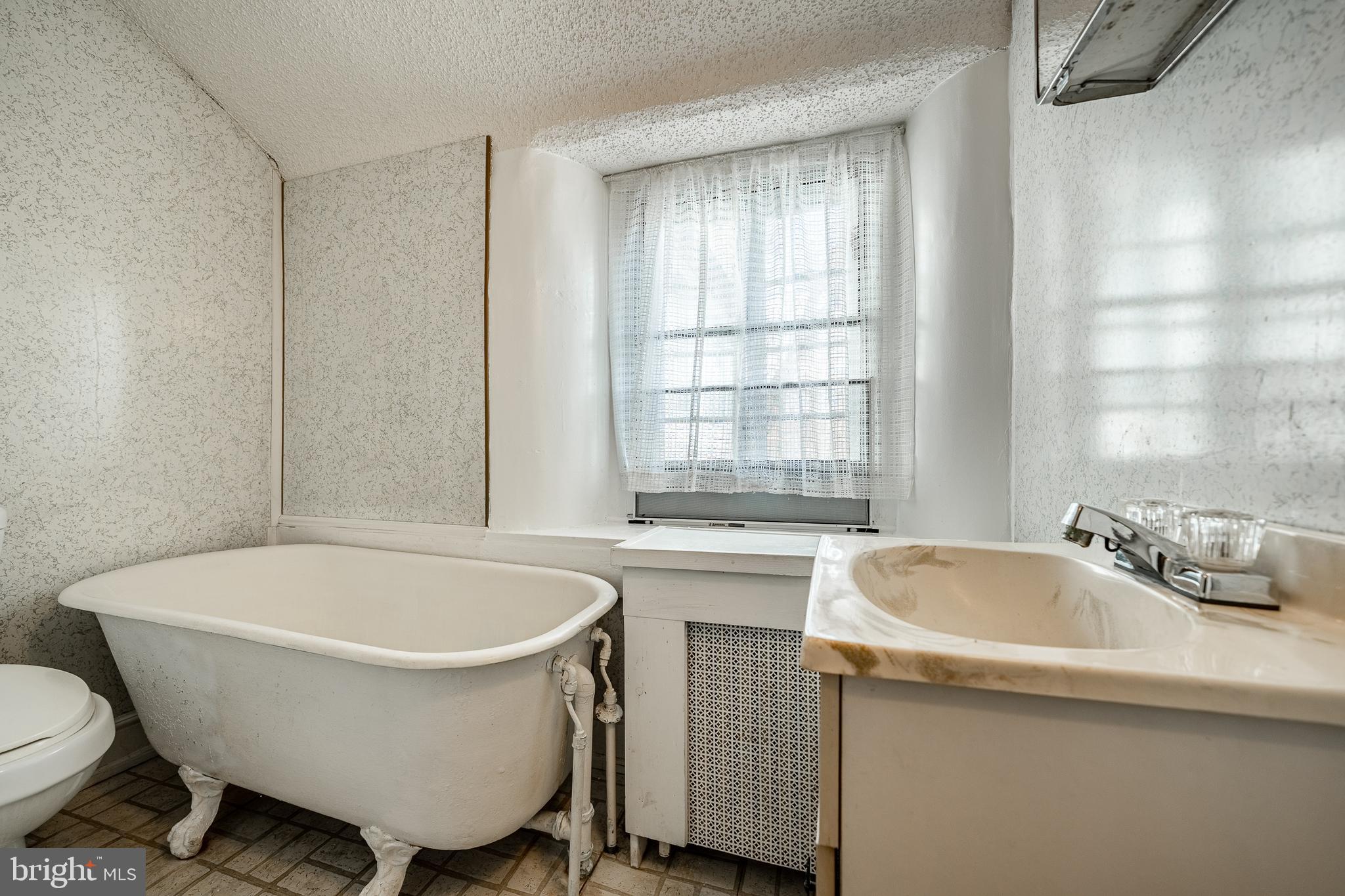 51 Scott Road Glen Mills, PA 19342 - Photo 49 of 85 a white bath tub sitting next to a white sink