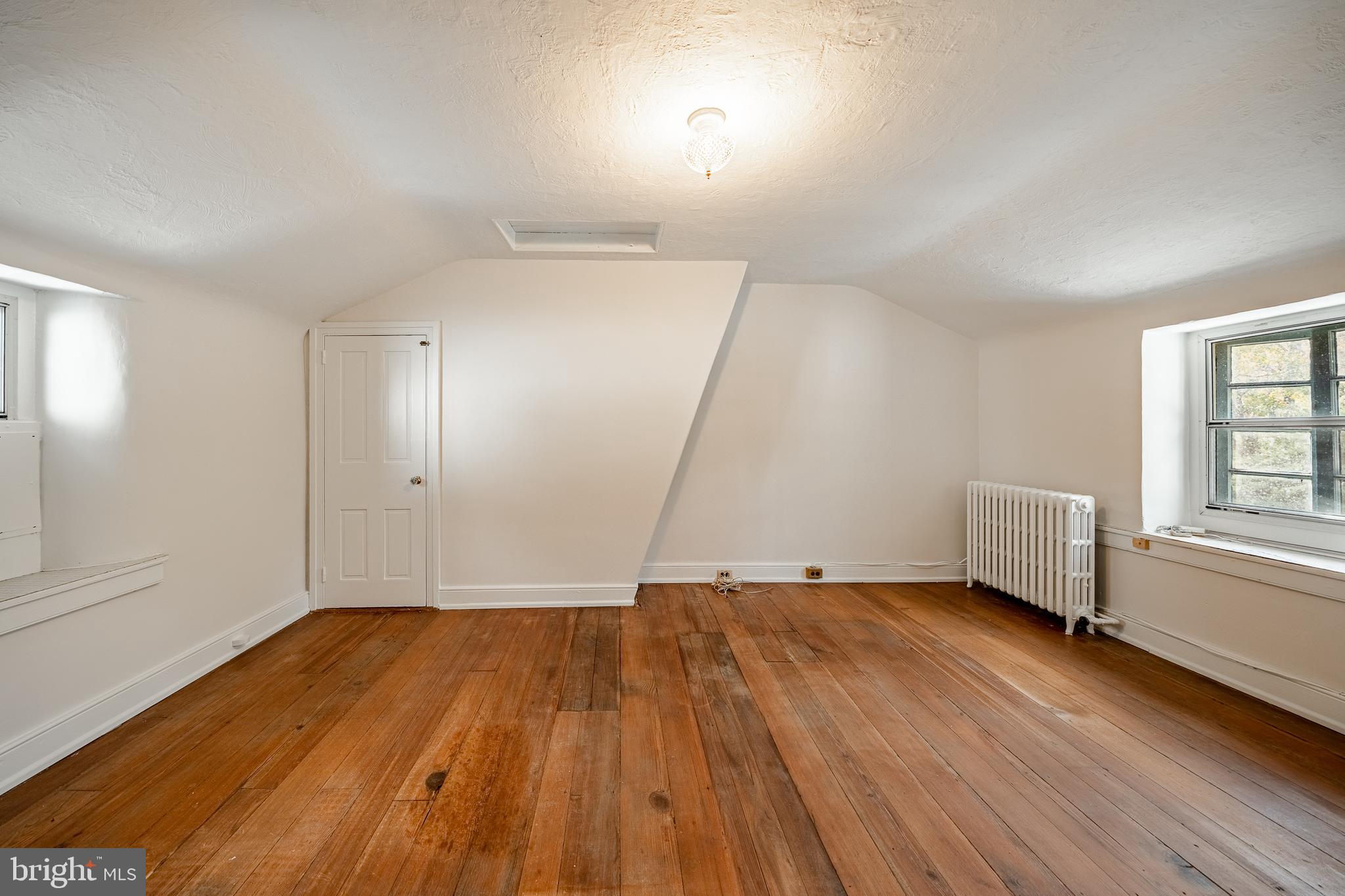 51 Scott Road Glen Mills, PA 19342 - Photo 50 of 85 an empty room with wooden floor and windows