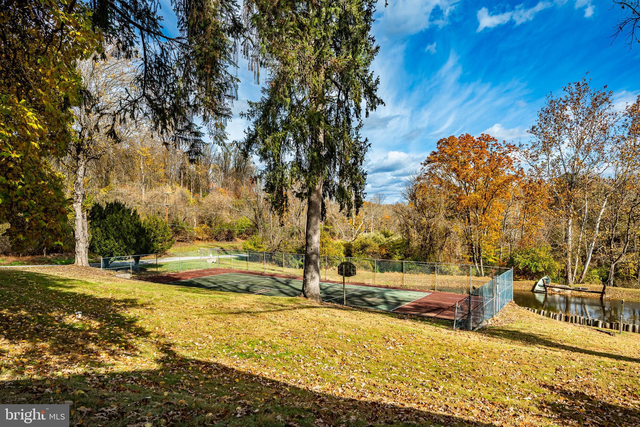 51 Scott Road Glen Mills, PA 19342 - Photo 64 of 85 a view of yard with swimming pool and trees