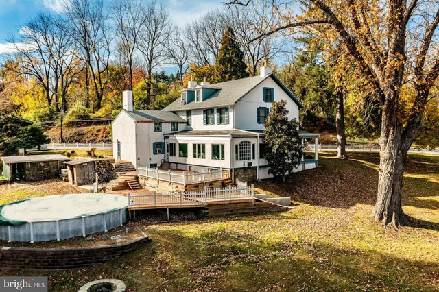 a view of a hallway with closet and stairs
